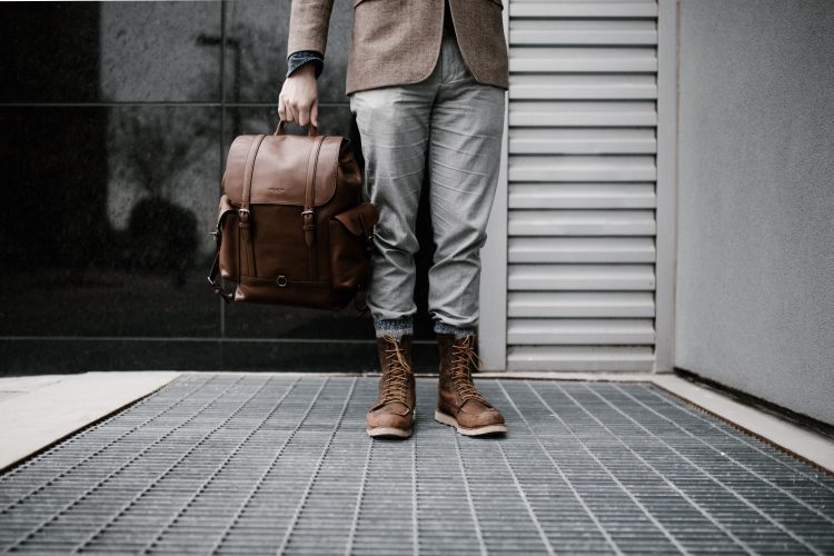 A man wearing brown army boot to the office.