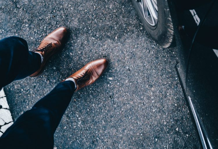 A pair of brown derby shoes.