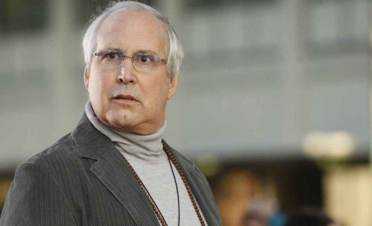 Chevy Chase making a serious funny face.