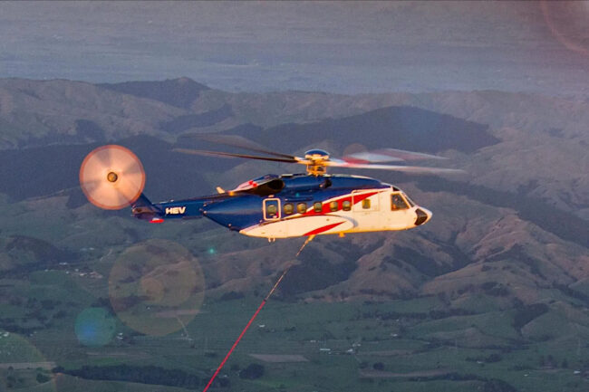 Watch a Helicopter Catch a Rocket Booster Falling Back from Space